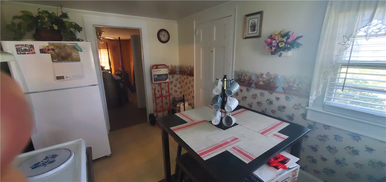 114 Hampton Street Pelzer, SC 29669 - Photo 18 of 21 This cozy kitchen offers an intimate setting for culinary endeavors and casual dining.