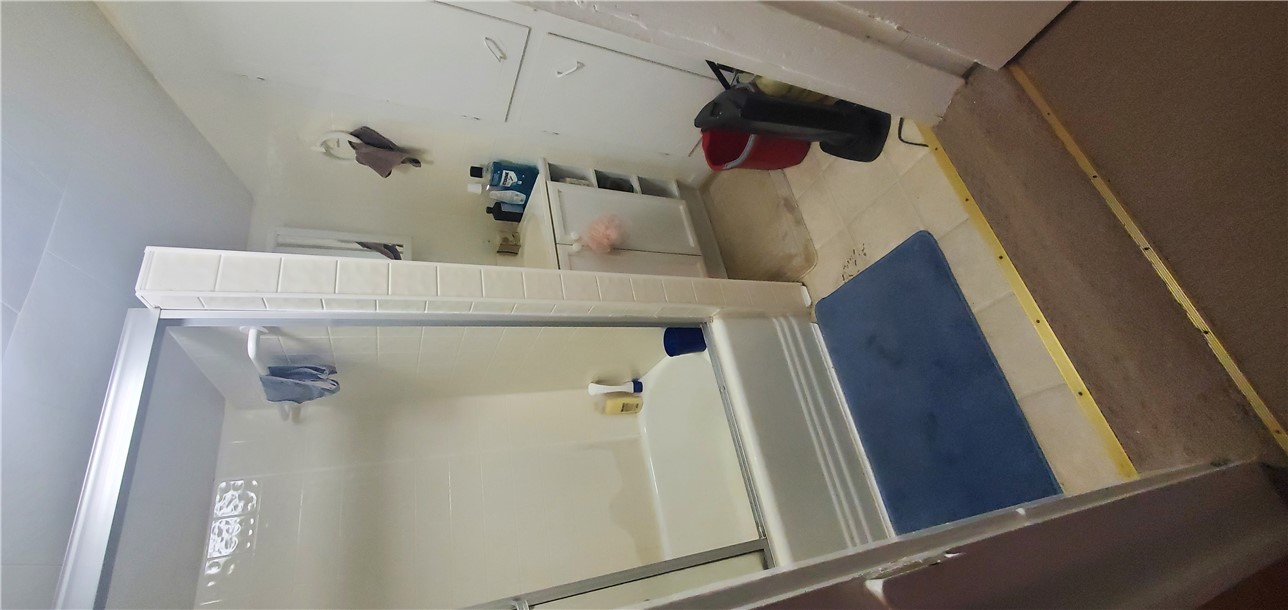 114 Hampton Street Pelzer, SC 29669 - Photo 20 of 21 This functional bathroom features a shower-tub combination and convenient storage solutions.