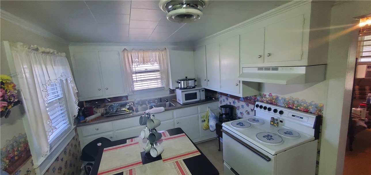114 Hampton Street Pelzer, SC 29669 - Photo 8 of 21 Functional kitchen with ample cabinet space, ready for your culinary creations.