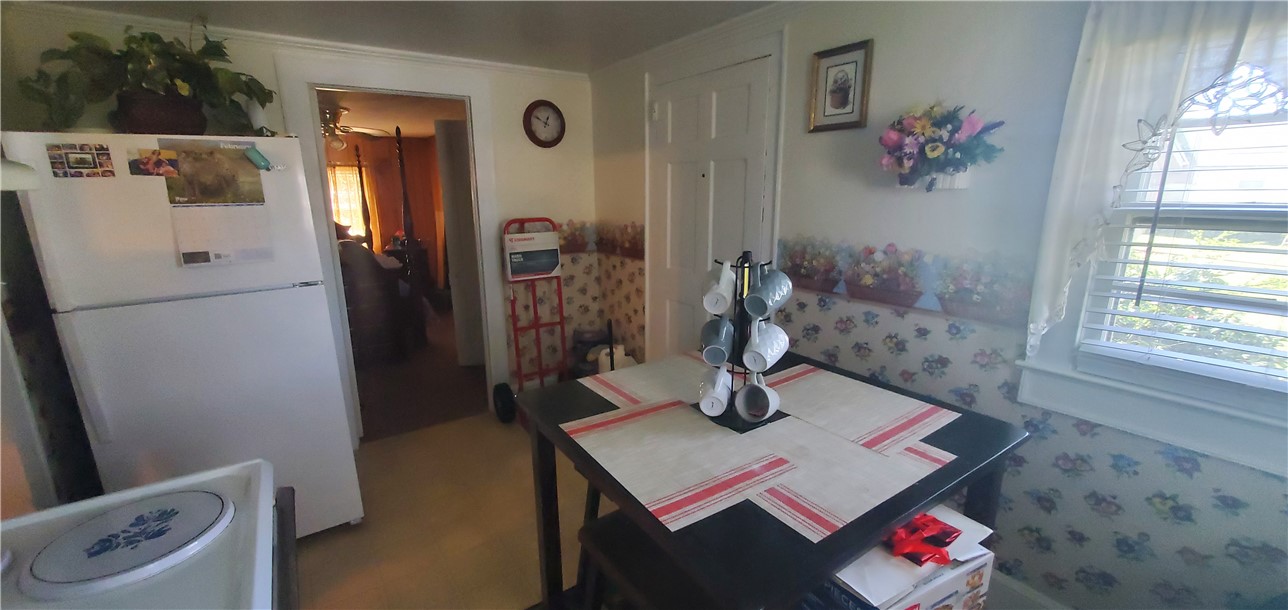 114 Hampton Street Pelzer, SC 29669 - Photo 9 of 21 This cozy kitchen area offers a welcoming atmosphere, perfect for casual meals and daily living.