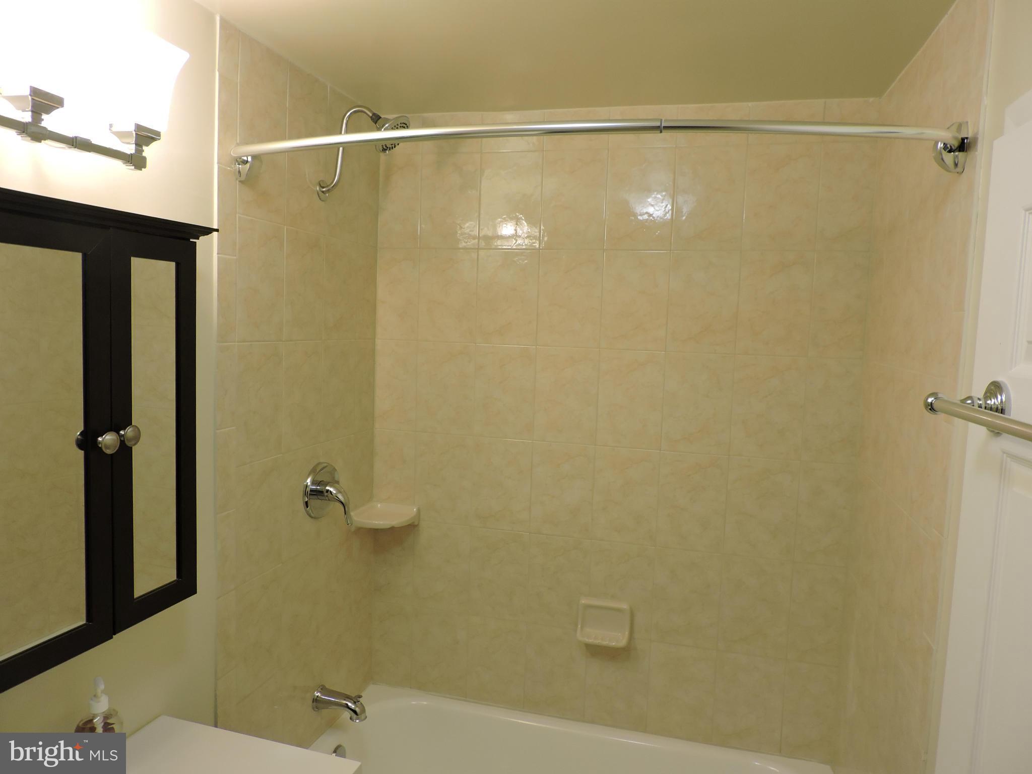 3911 Annapolis Road Halethorpe, MD 21227 - Photo 16 of 24 a bathroom with a shower and a toilet