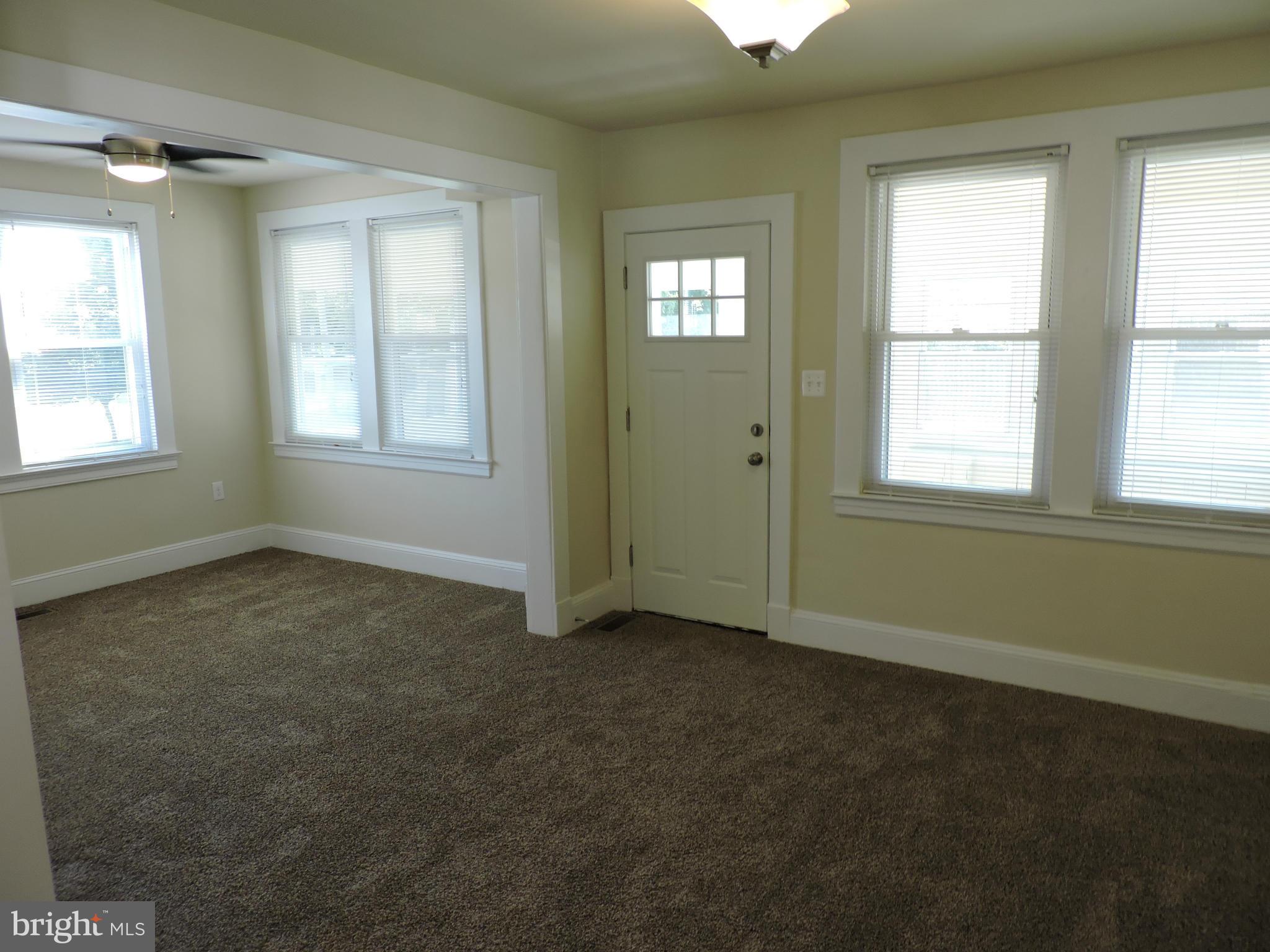 3911 Annapolis Road Halethorpe, MD 21227 - Photo 4 of 24 an empty room with windows