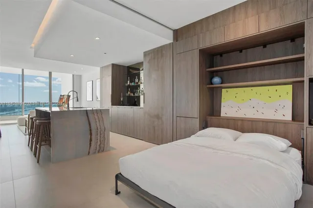 a bedroom with a bed and a table