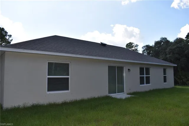 a backyard of a house with lots of green space