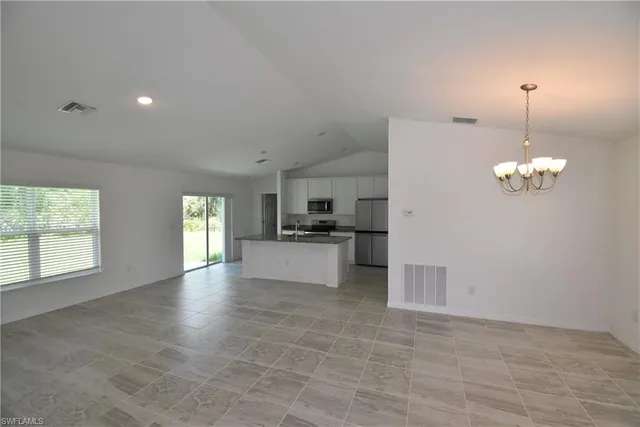 a view of a kitchen with electric appliances