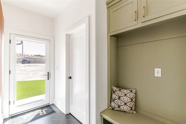 a view of an entryway with wooden floor