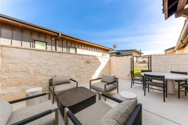 a patio with patio outdoor seating and barbeque