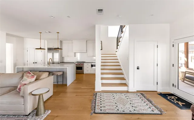 a view of kitchen with furniture and wooden floor