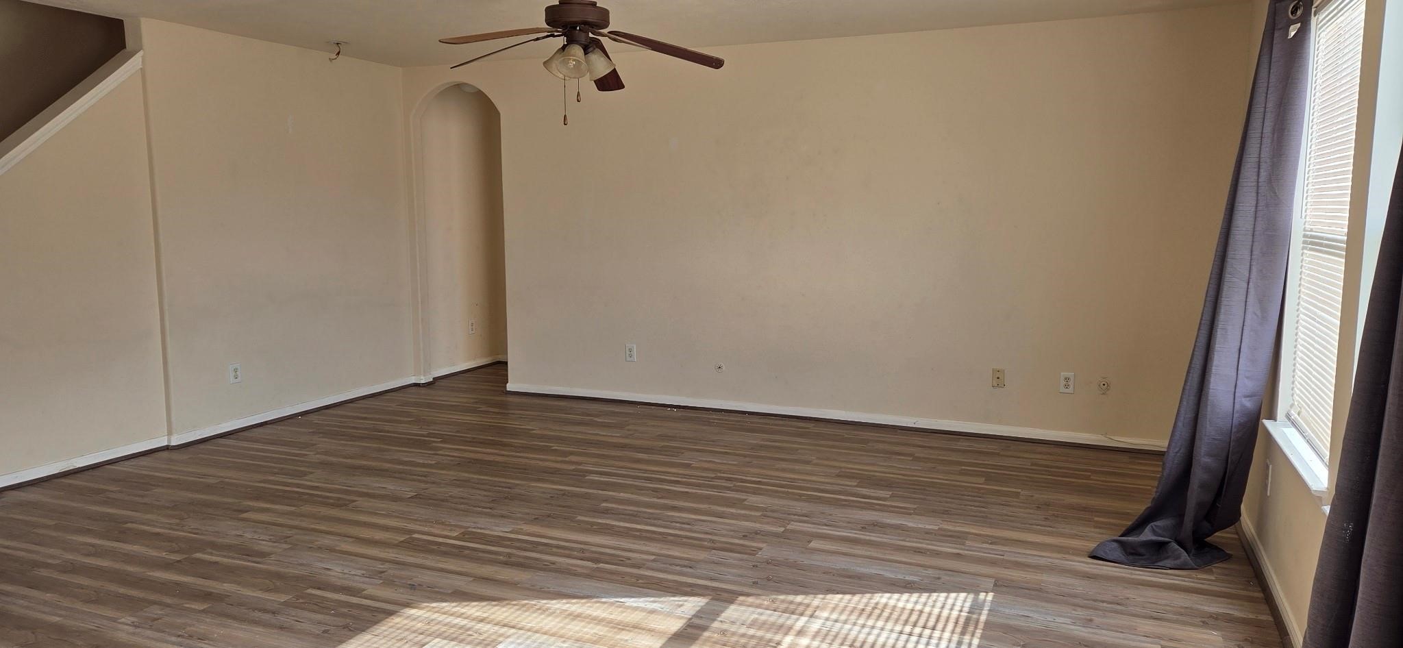 14127 Magnus Lane Houston, TX 77083 - Photo 8 of 16 a view of a room with wooden floor and a window