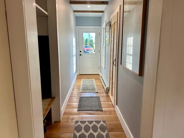 a view of gallery with wooden floor
