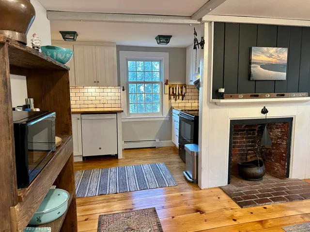 a kitchen with sink and cabinets