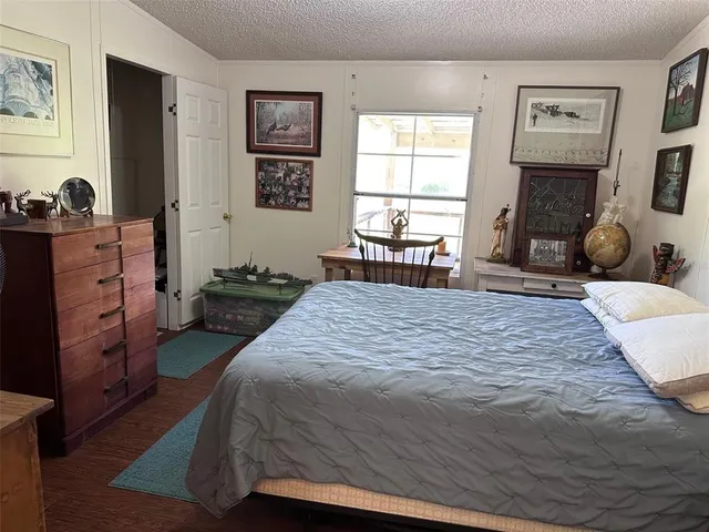 a bed room with a bed window and wall painting