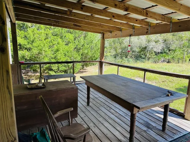 a view of a two chairs in the deck