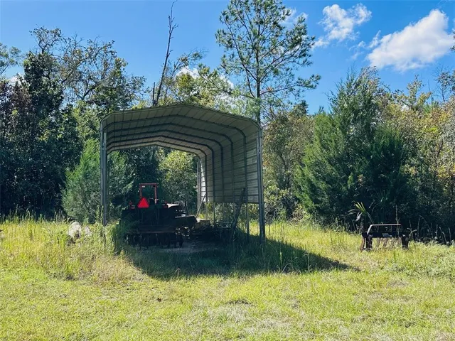 a backyard of a house with yard and swimming pool