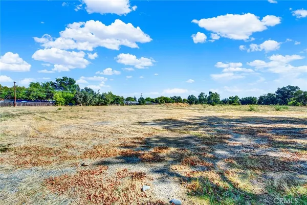 a view of a lake with houses in the background