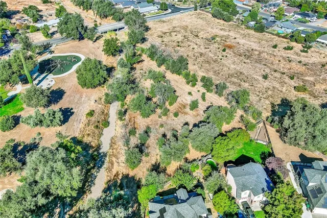 an aerial view of a house with a yard and garden
