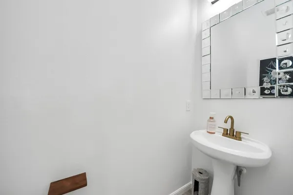 a bathroom with a sink a mirror and vanity