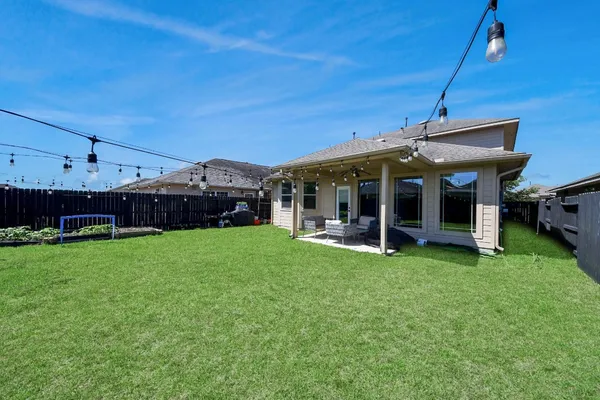 a view of a house with a garden and porch