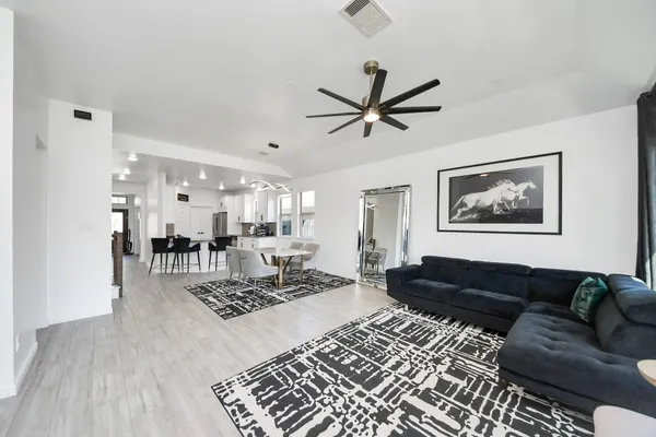 a living room with furniture and a rug