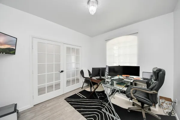 a workspace with furniture and a window