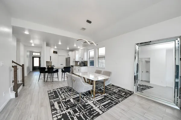 a living room with furniture and a rug