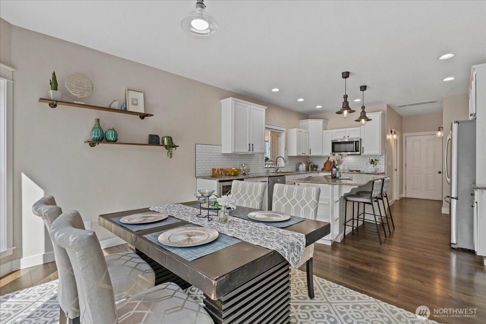 22005 260th Avenue Southeast Maple Valley, WA 98038 - Photo 15 of 39 a view of a dining room with furniture and wooden floor