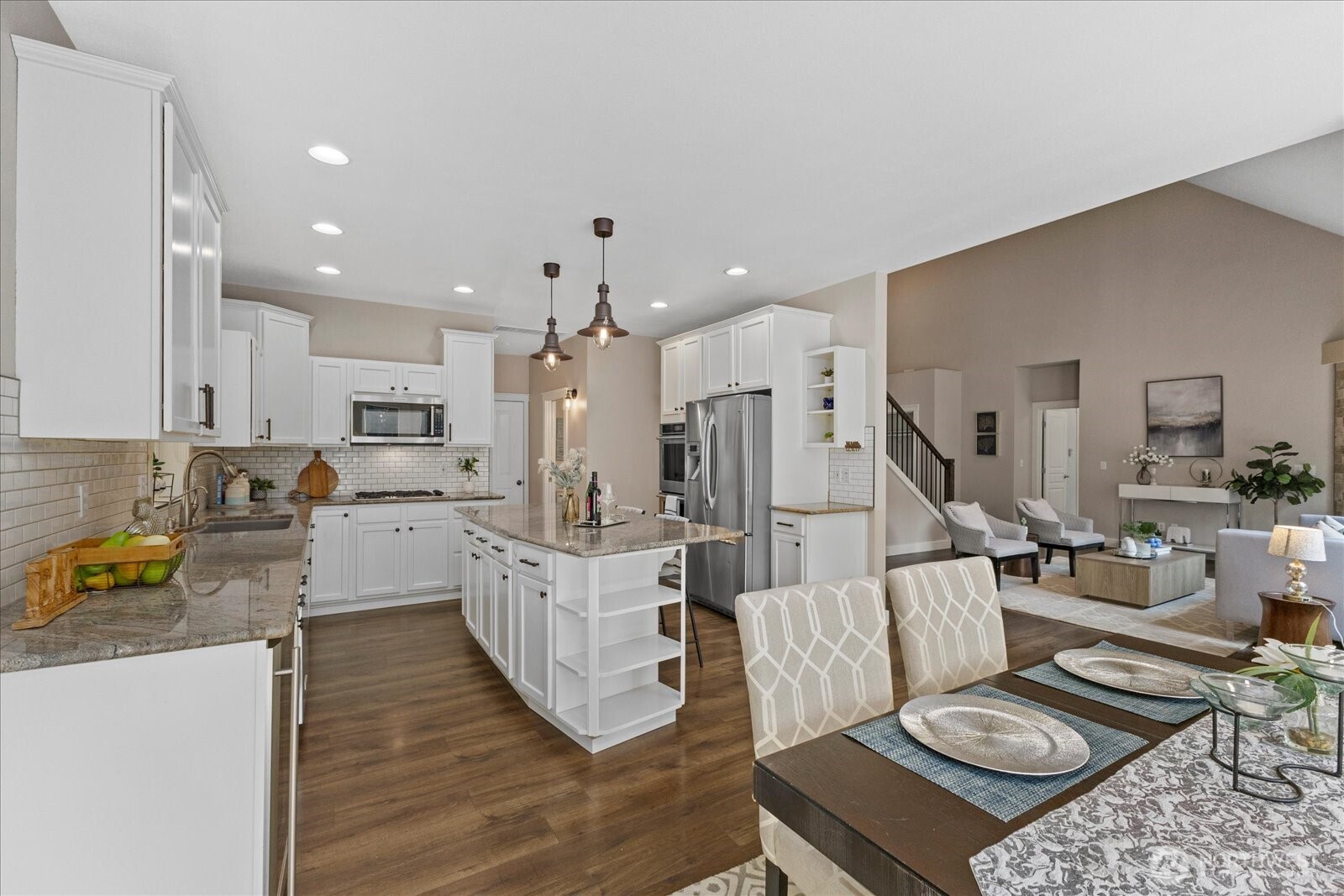 22005 260th Avenue Southeast Maple Valley, WA 98038 - Photo 18 of 39 a living room with furniture kitchen and a table