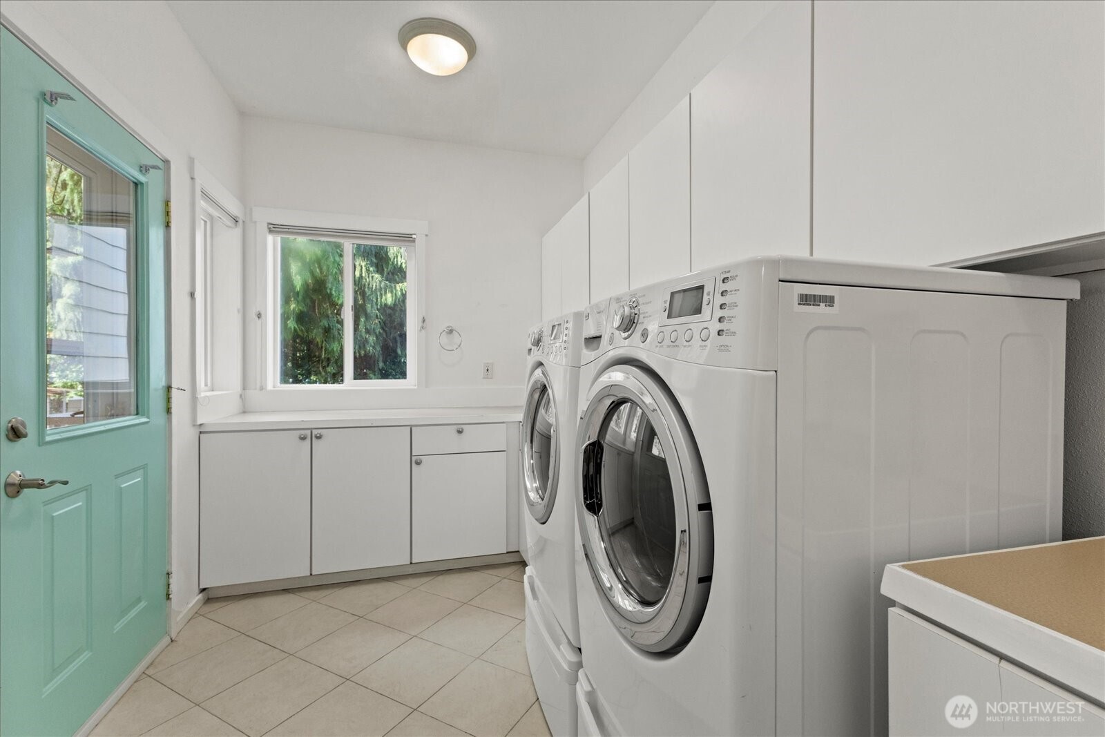 22005 260th Avenue Southeast Maple Valley, WA 98038 - Photo 19 of 39 a utility room with dryer and washer