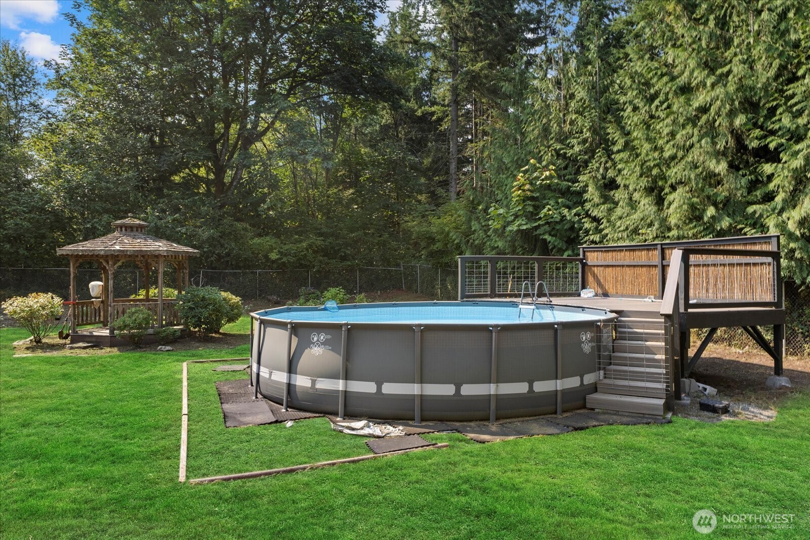 22005 260th Avenue Southeast Maple Valley, WA 98038 - Photo 30 of 39 a view of an house with backyard space and sitting area