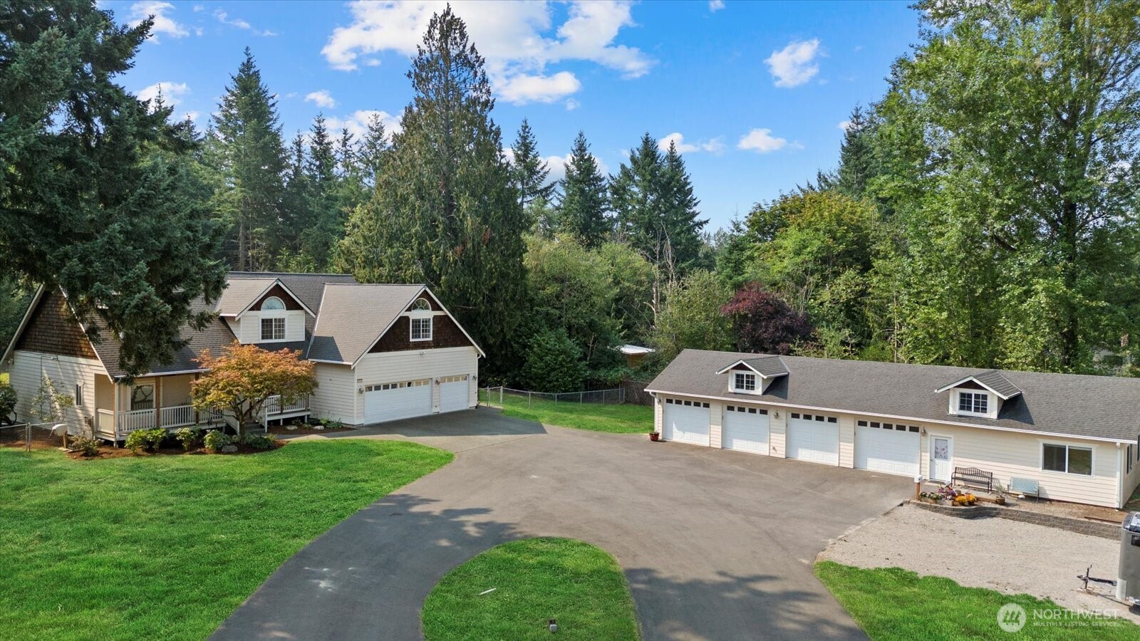 22005 260th Avenue Southeast Maple Valley, WA 98038 - Photo 3 of 39 a view of a house with a yard and sitting area