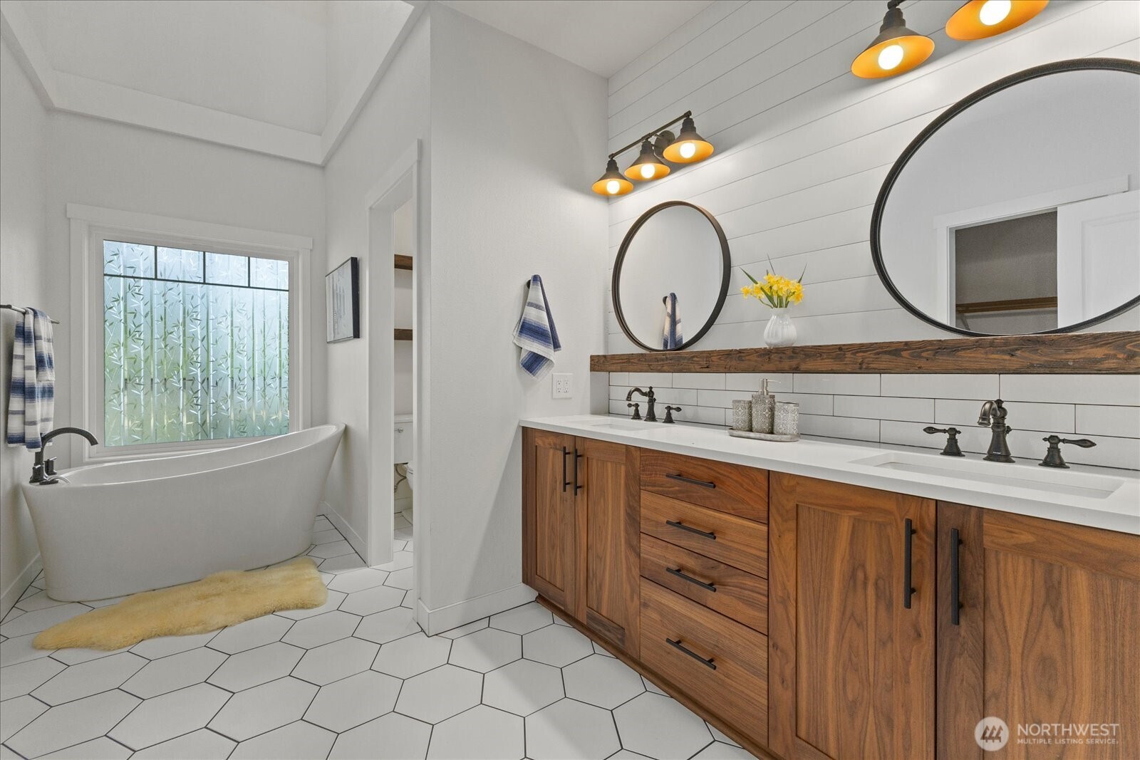 22005 260th Avenue Southeast Maple Valley, WA 98038 - Photo 6 of 39 a bathroom with a double vanity sink and a mirror