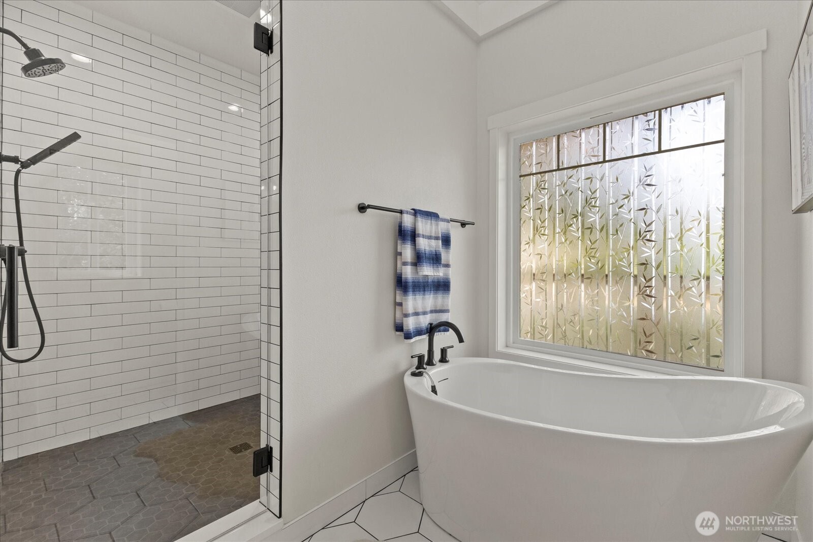 22005 260th Avenue Southeast Maple Valley, WA 98038 - Photo 7 of 39 a white bath tub sitting next to a shower