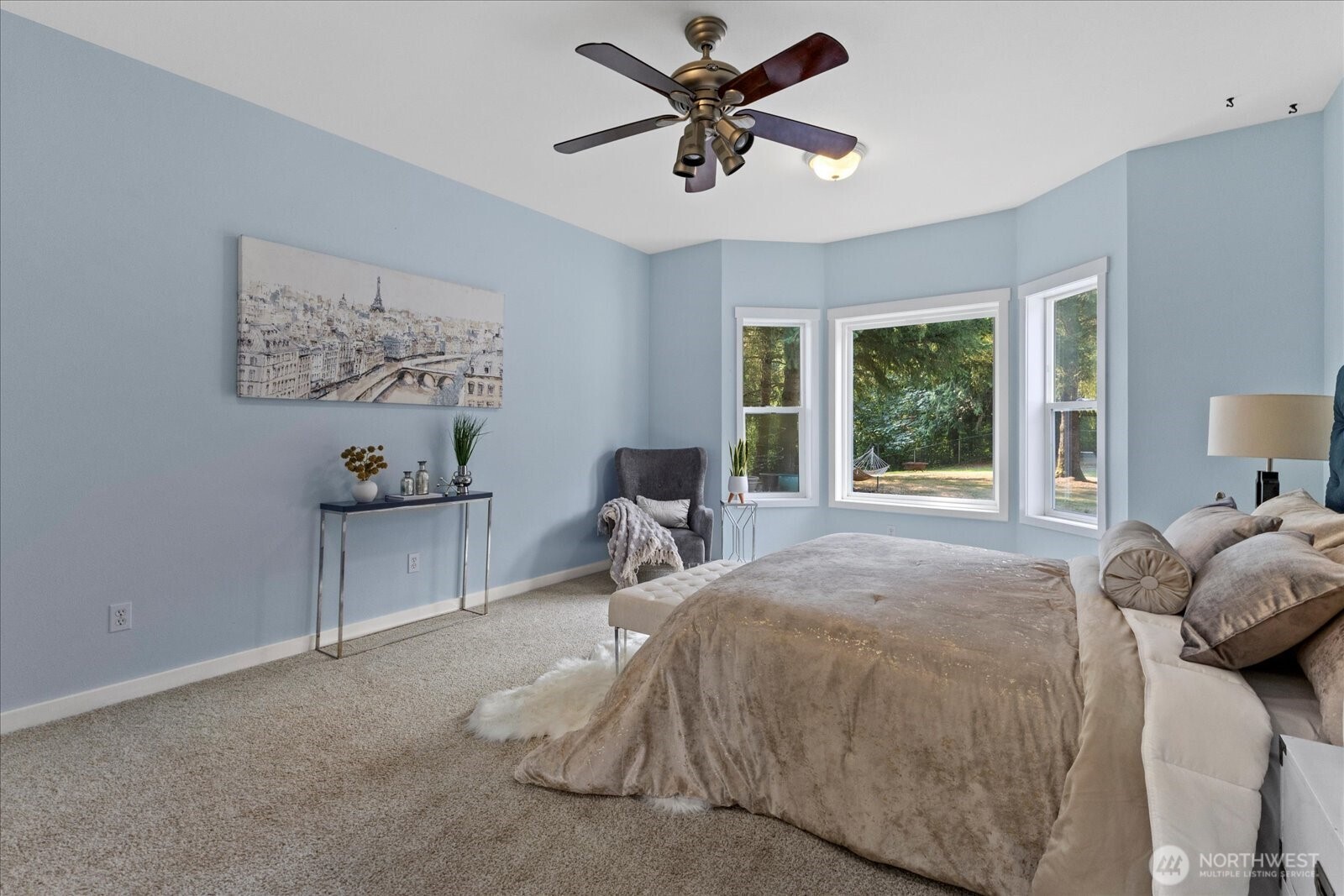 22005 260th Avenue Southeast Maple Valley, WA 98038 - Photo 8 of 39 a bedroom with a bed and a chandelier