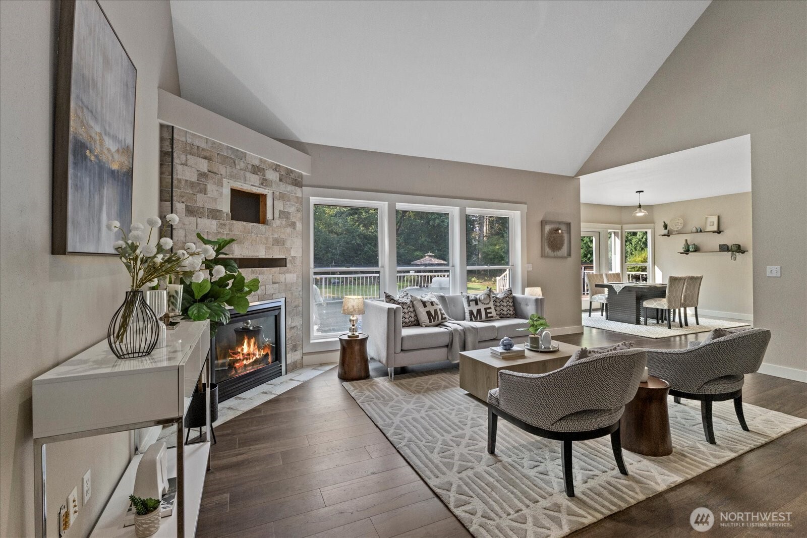 22005 260th Avenue Southeast Maple Valley, WA 98038 - Photo 9 of 39 a living room with furniture a fireplace and a potted plant
