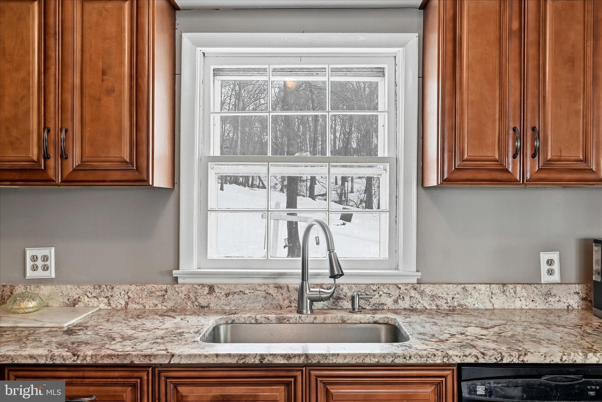 18758 Telegraph Springs Road Purcellville, VA 20132 - Photo 11 of 59 a kitchen with granite countertop sink and cabinets
