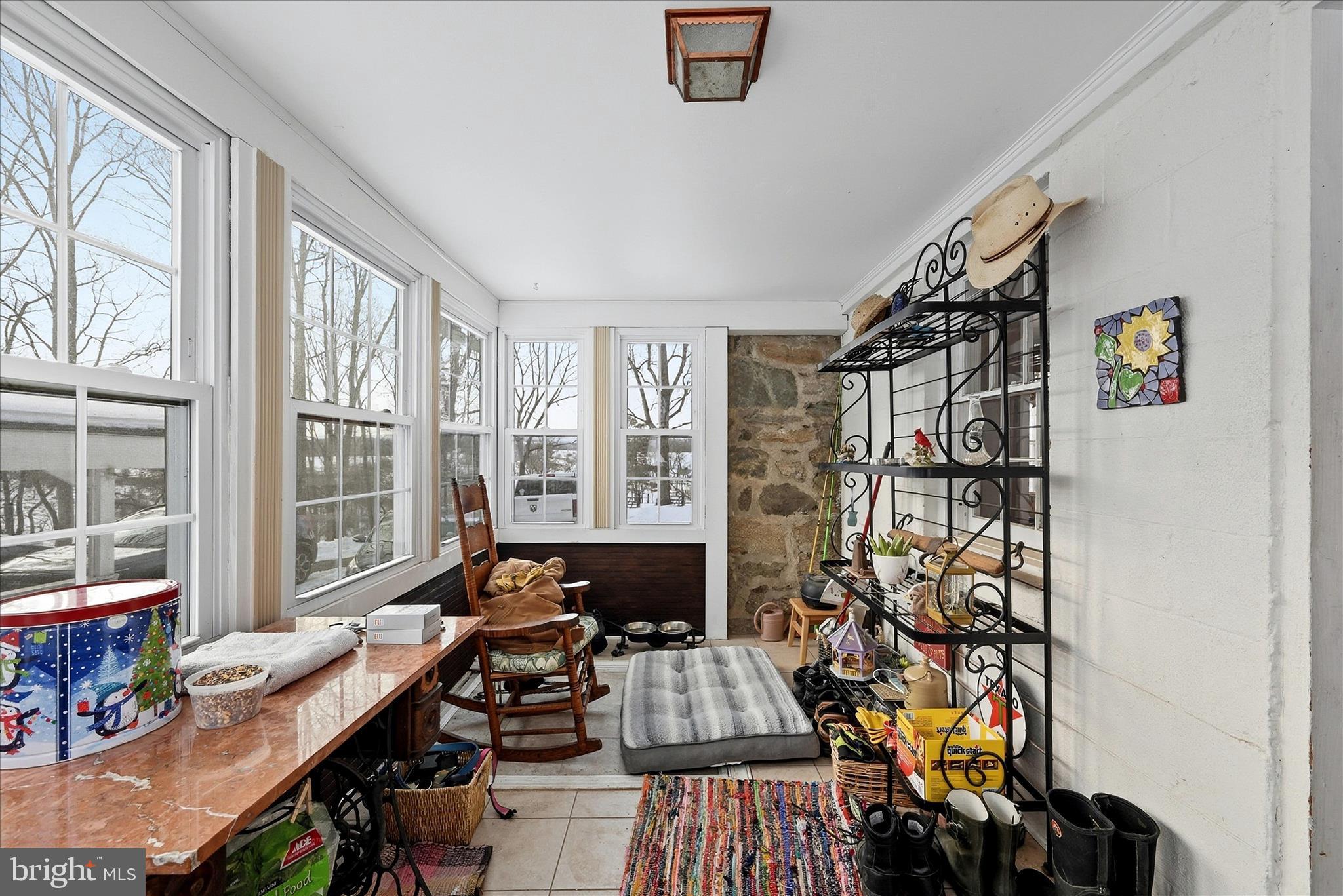 18758 Telegraph Springs Road Purcellville, VA 20132 - Photo 14 of 59 a bedroom with furniture and a large window