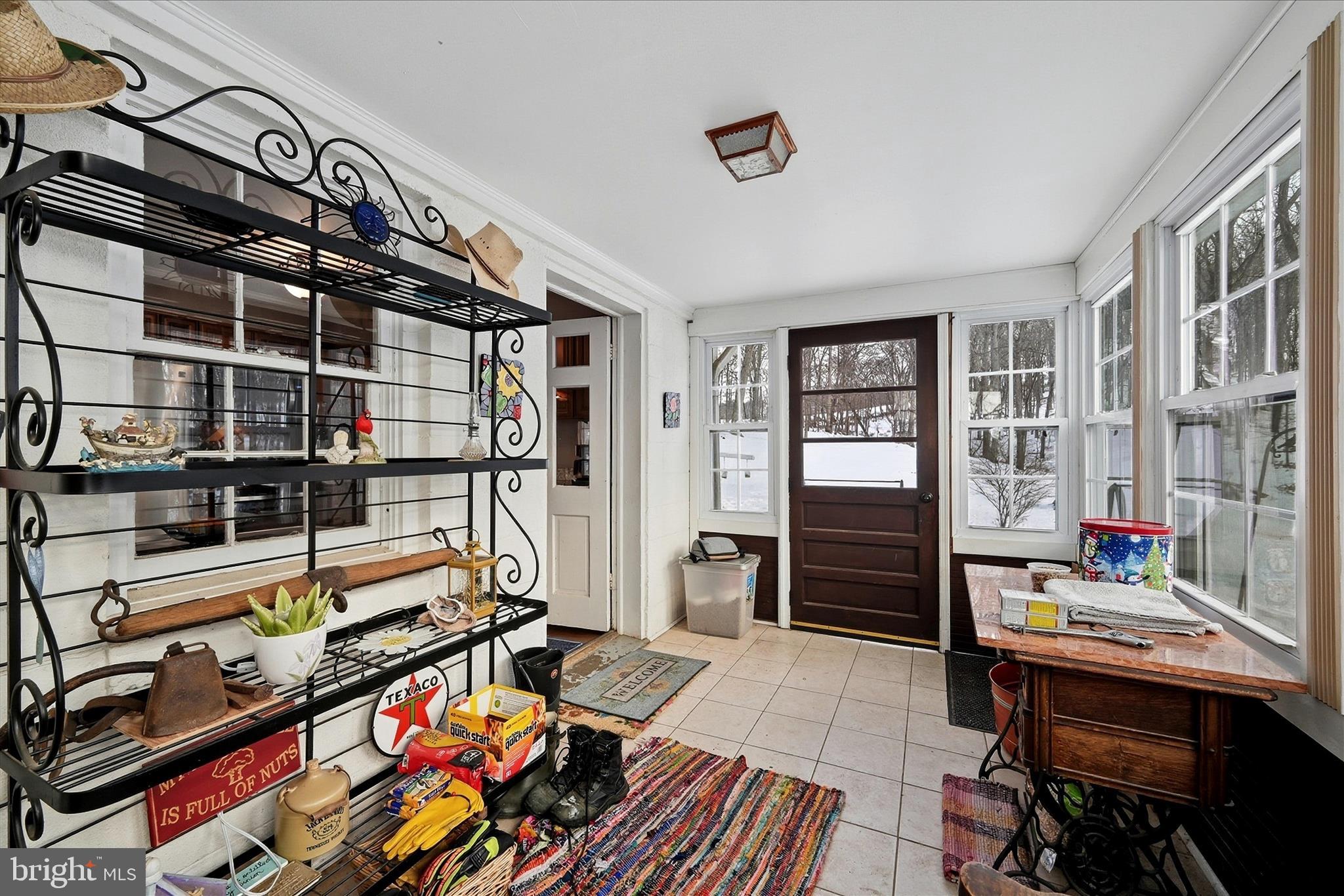 18758 Telegraph Springs Road Purcellville, VA 20132 - Photo 15 of 59 a bed room with a bed and a book shelf
