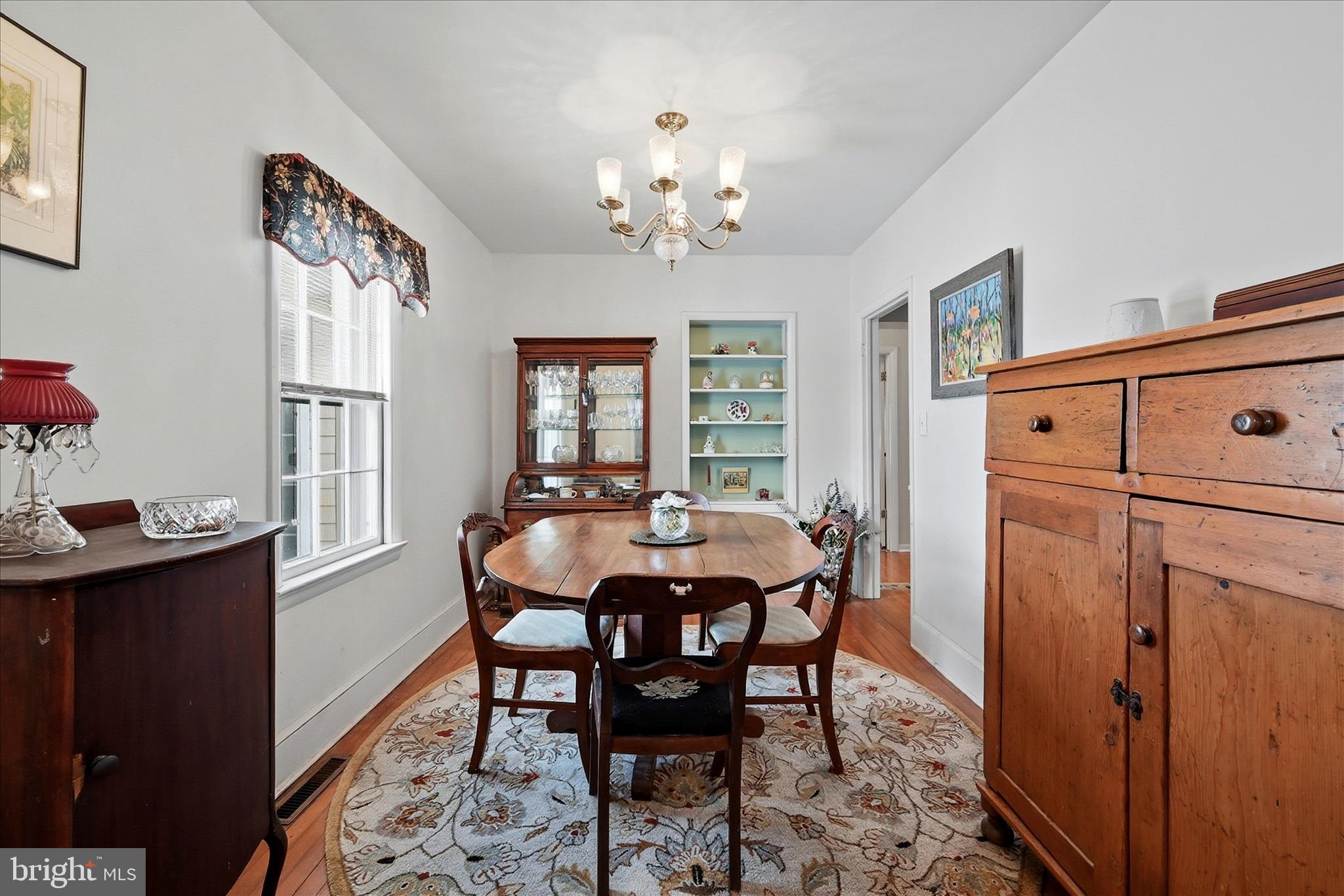 18758 Telegraph Springs Road Purcellville, VA 20132 - Photo 18 of 59 a view of a dining room with furniture and chandelier