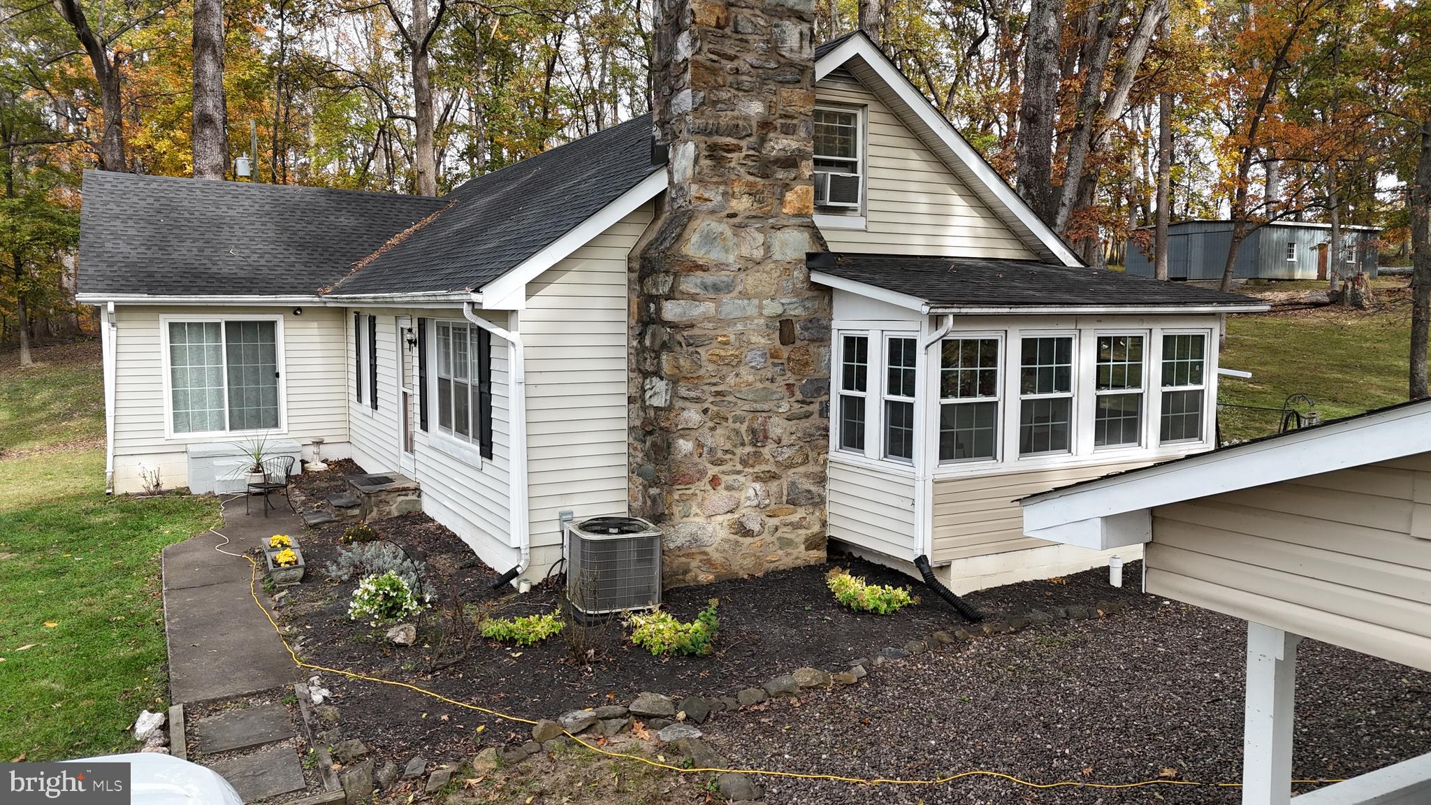 18758 Telegraph Springs Road Purcellville, VA 20132 - Photo 2 of 59 a front view of a house with a yard