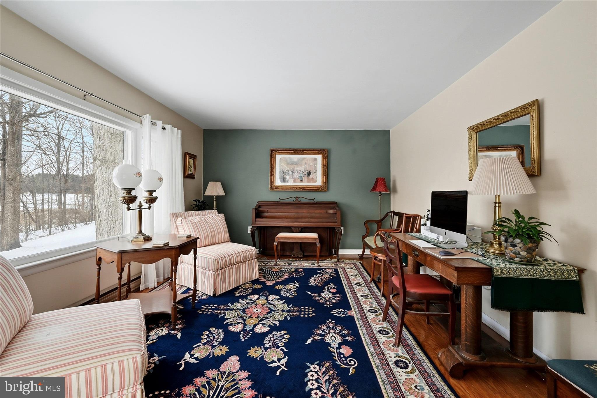 18758 Telegraph Springs Road Purcellville, VA 20132 - Photo 21 of 59 a living room with furniture and a flat screen tv