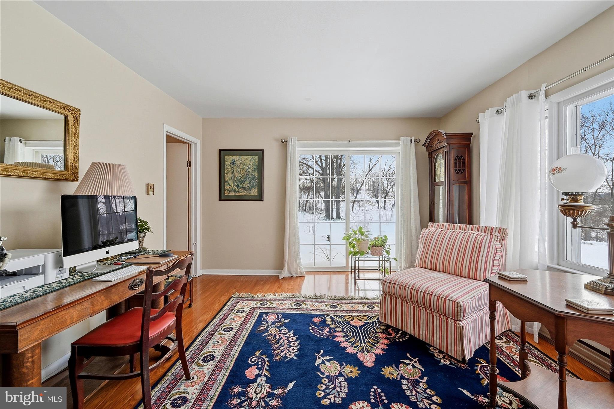 18758 Telegraph Springs Road Purcellville, VA 20132 - Photo 23 of 59 a bedroom with furniture and a rug