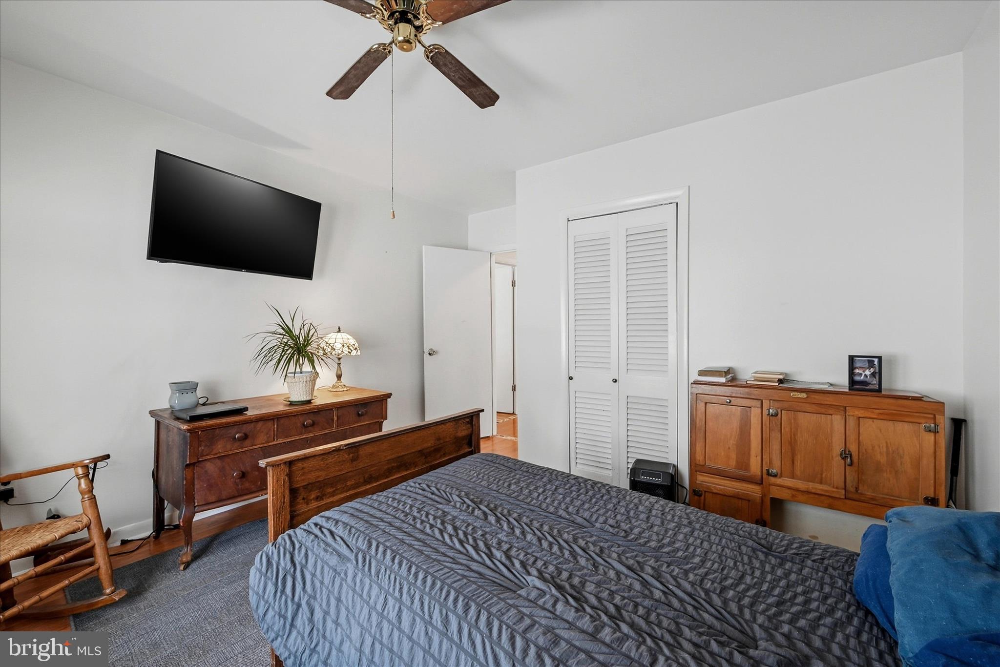 18758 Telegraph Springs Road Purcellville, VA 20132 - Photo 29 of 59 a bedroom with a bed and flat screen tv