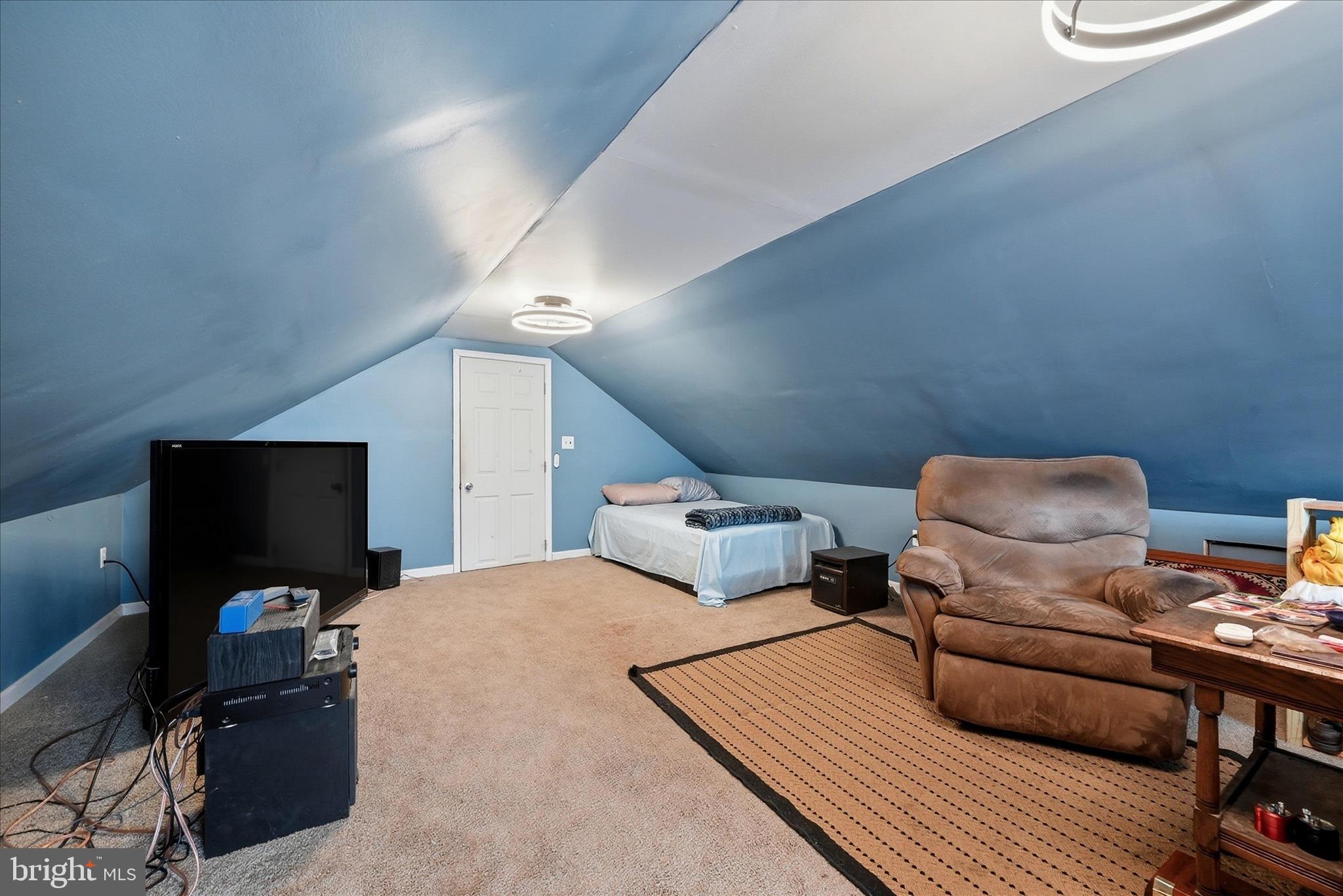 18758 Telegraph Springs Road Purcellville, VA 20132 - Photo 33 of 59 a bedroom with furniture and a flat screen tv