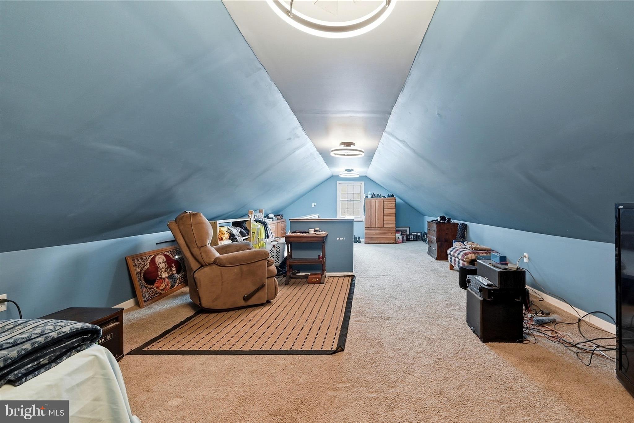 18758 Telegraph Springs Road Purcellville, VA 20132 - Photo 34 of 59 a living room with furniture and a mirror