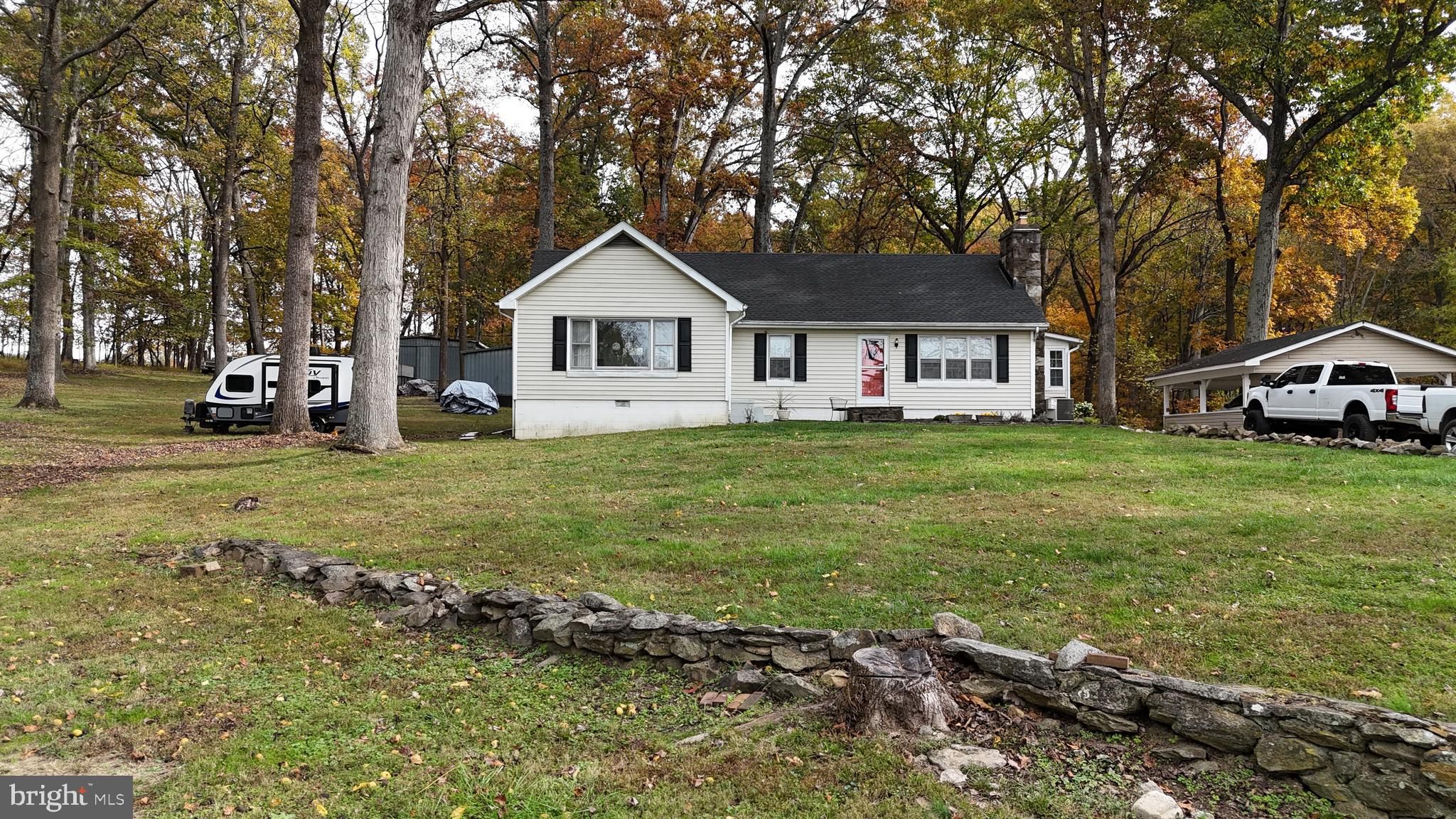 18758 Telegraph Springs Road Purcellville, VA 20132 - Photo 40 of 59 a front view of a house with a yard