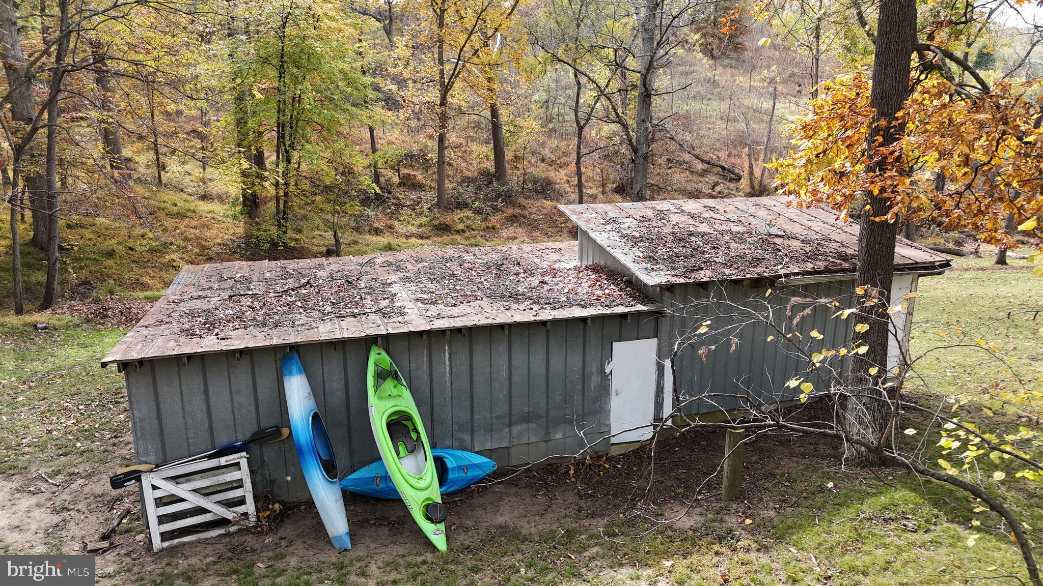 18758 Telegraph Springs Road Purcellville, VA 20132 - Photo 43 of 59 a view of backyard with wooden fence and a large tree