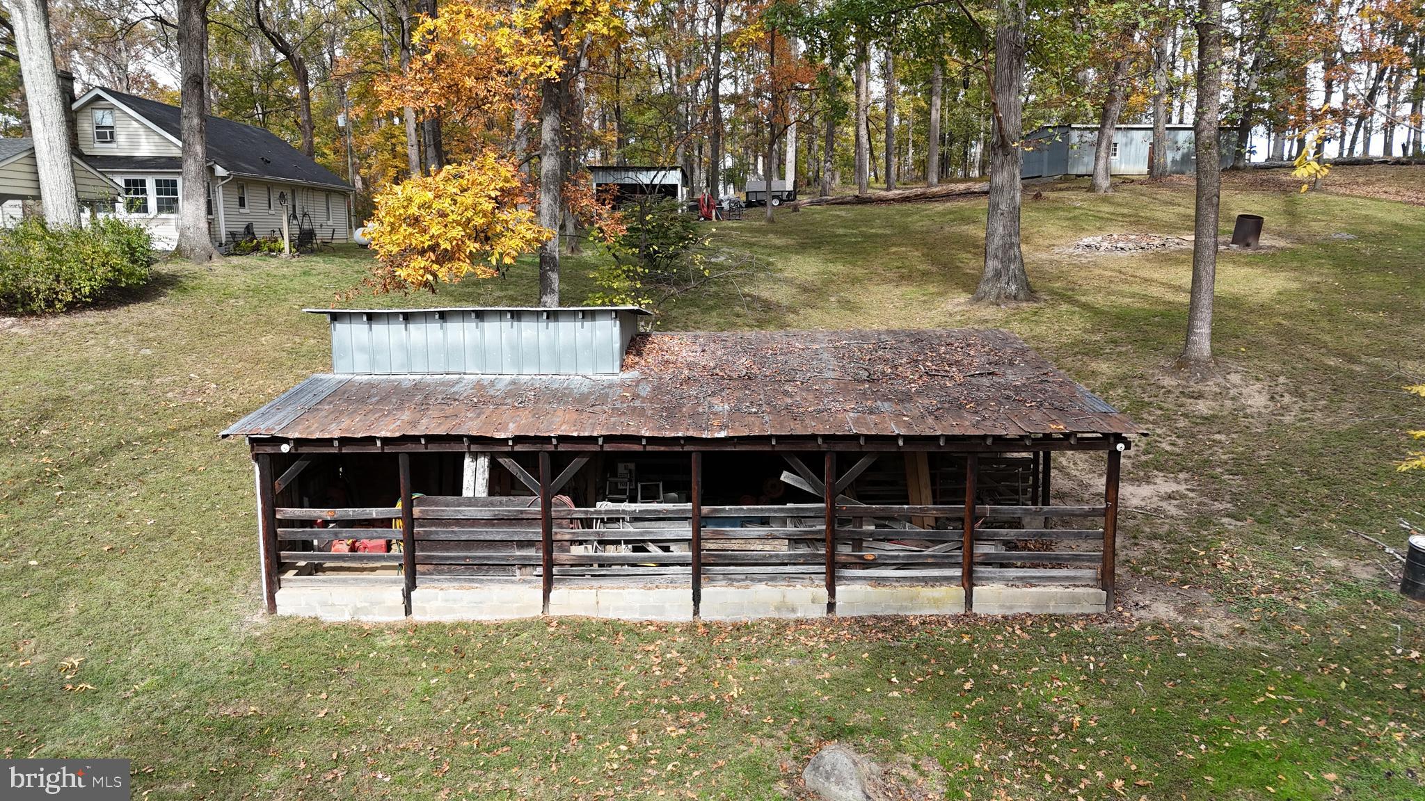 18758 Telegraph Springs Road Purcellville, VA 20132 - Photo 45 of 59 a backyard of a house with table and chairs