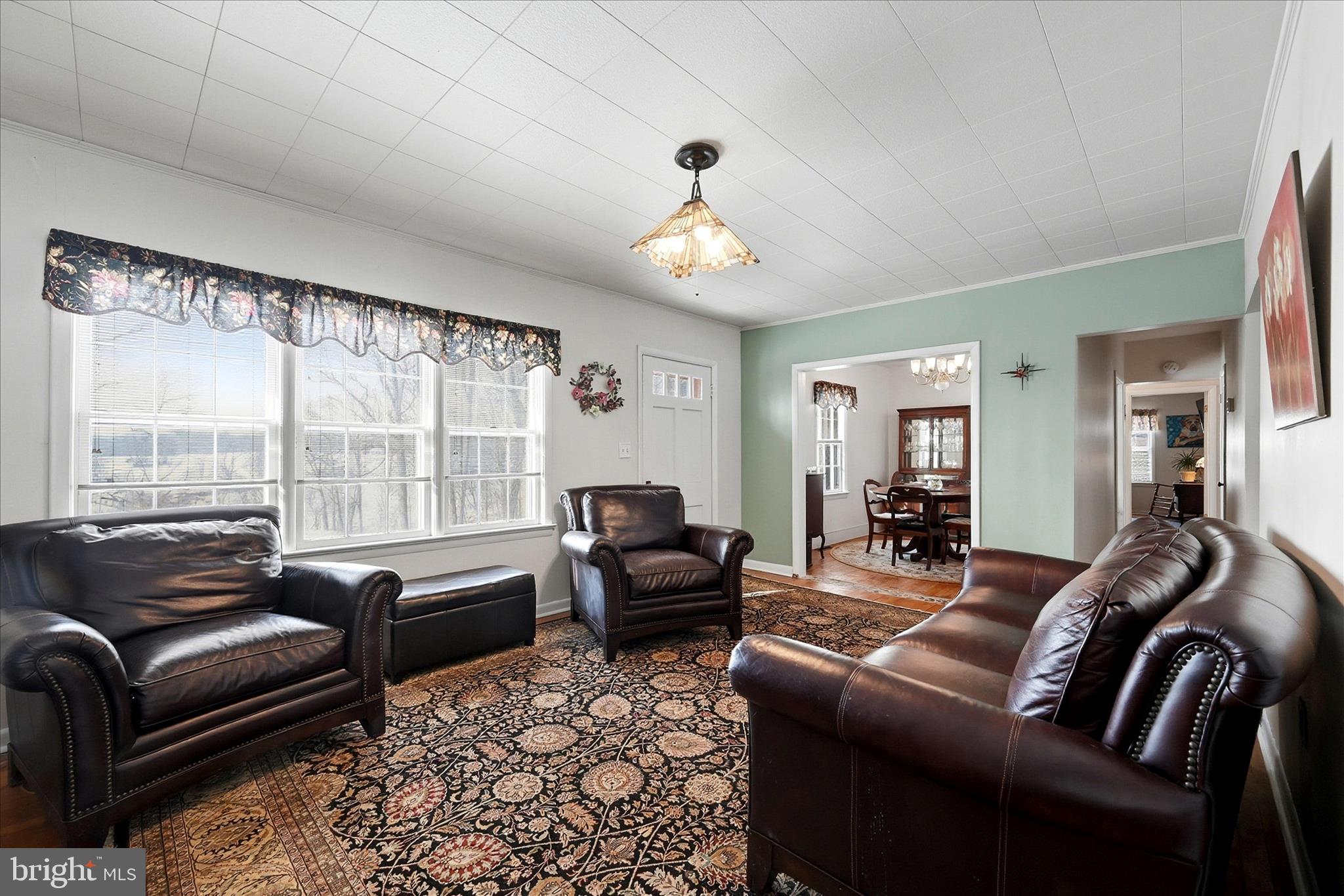18758 Telegraph Springs Road Purcellville, VA 20132 - Photo 6 of 59 a living room with furniture and a large window
