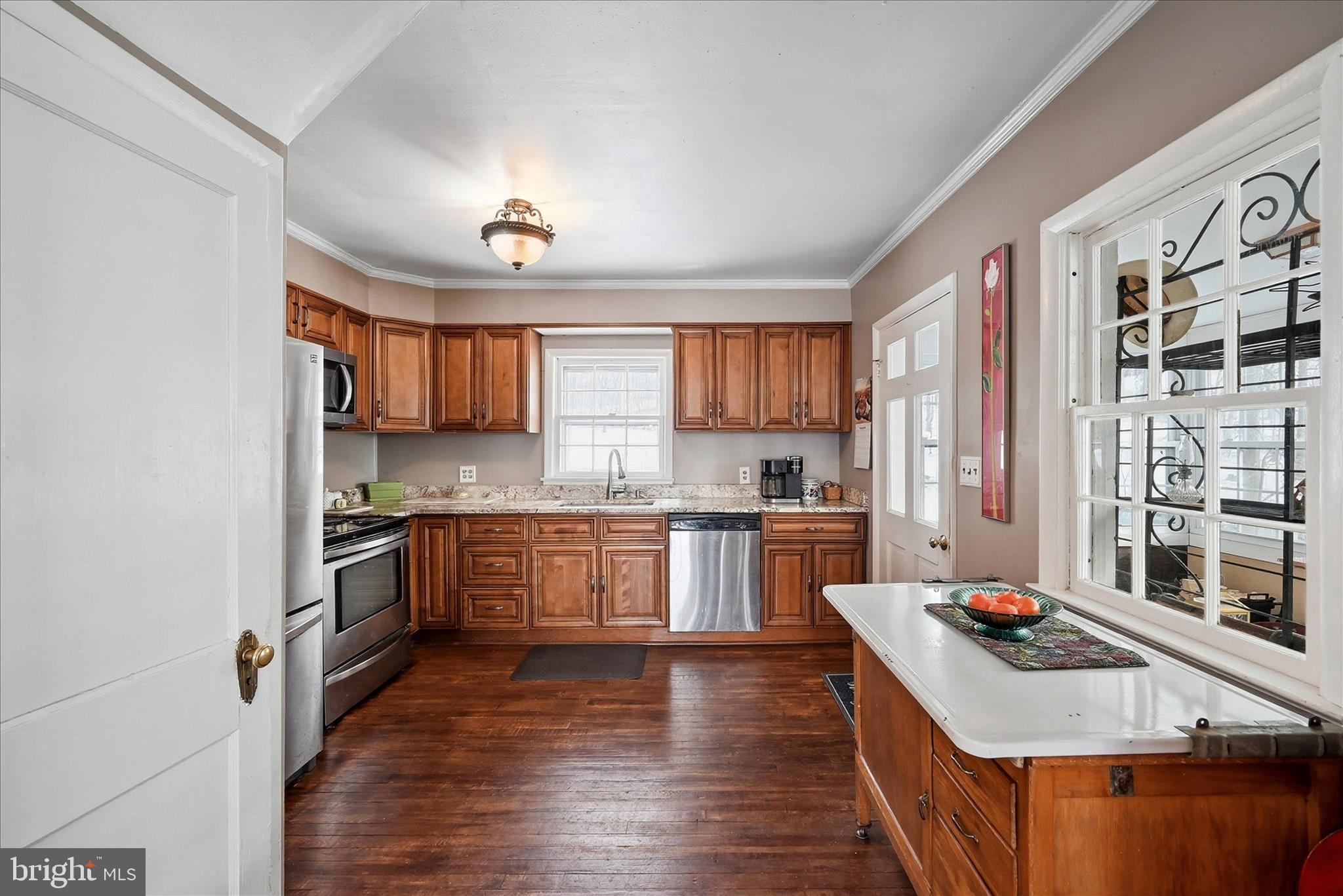 18758 Telegraph Springs Road Purcellville, VA 20132 - Photo 9 of 59 a kitchen with stainless steel appliances granite countertop a stove and a sink