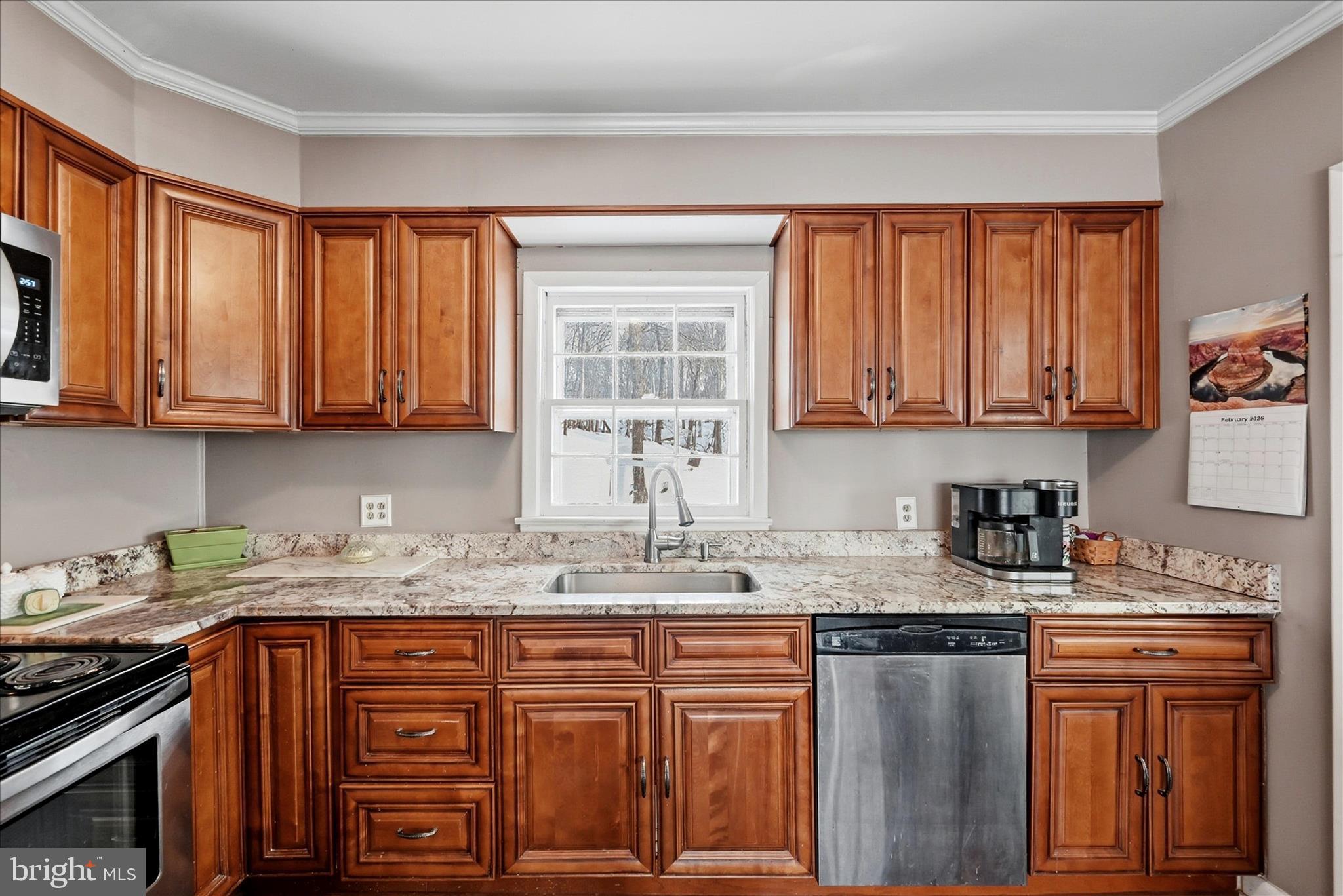 18758 Telegraph Springs Road Purcellville, VA 20132 - Photo 10 of 59 a kitchen with stainless steel appliances granite countertop a sink stove and cabinets